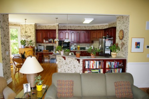 Before picture showing outdated kitchen cabinets, design and countertop)