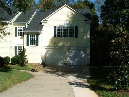 After the addition, this picture shows the final garage expansion and how a second floor was added above garage