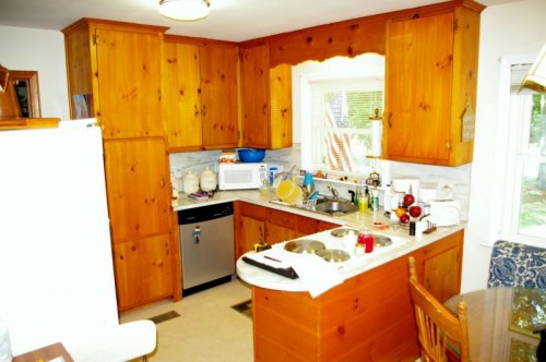 Kitchen Remodel - Before Before kitchen remodel with view of outdated appliances, awkward countertop and limited space