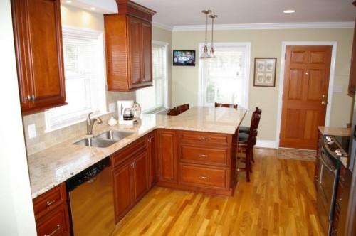 Kitchen Remodel - After New kitchen after remodel with view of updated cabinets, appliances and new granite countertop