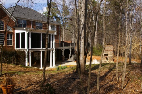Inside Out After home addition photo of deck expansion, screened porch addition and outdoor fireplace