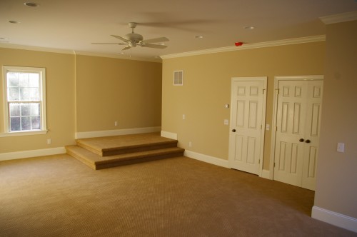 New room after the unfinished attic space above the garage was transformed into new family room