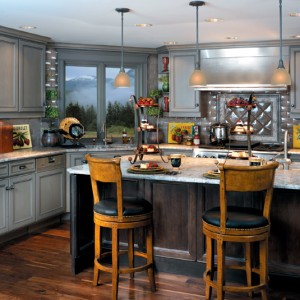 Newly remodeled kitchen in Charlotte, NC with beautiful gray tones integrated throughout the kitchen's design, including the granite, cabinets, backsplash and fixtures