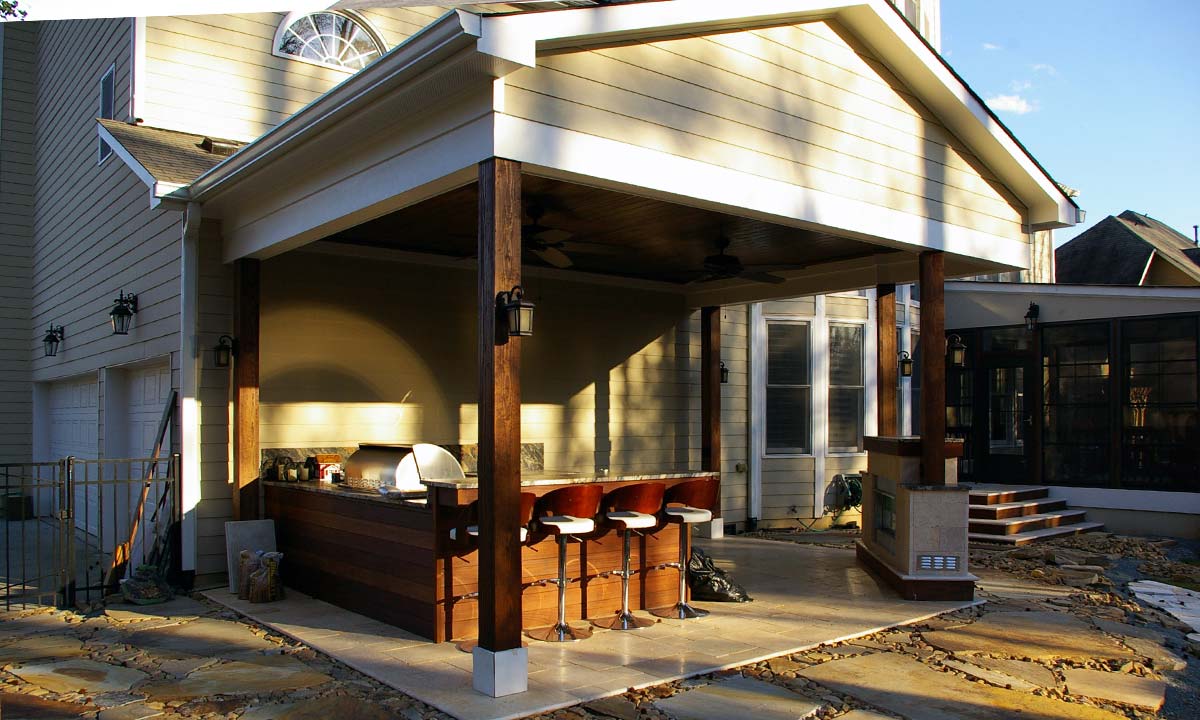 Completed outdoor porch with bar, grill and fireplace