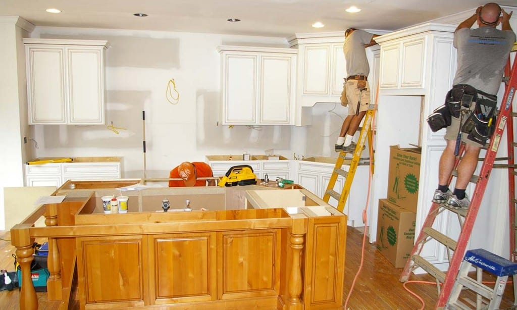 Photo of custom kitchen island and cabinets being built and installed
