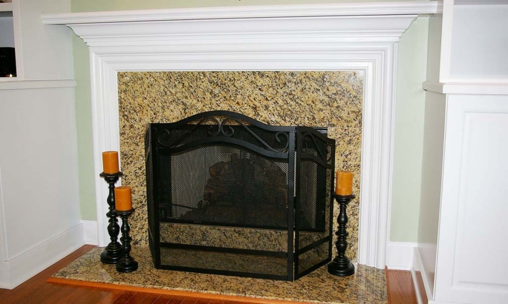 New granite fireplace acts as the room's new focal point