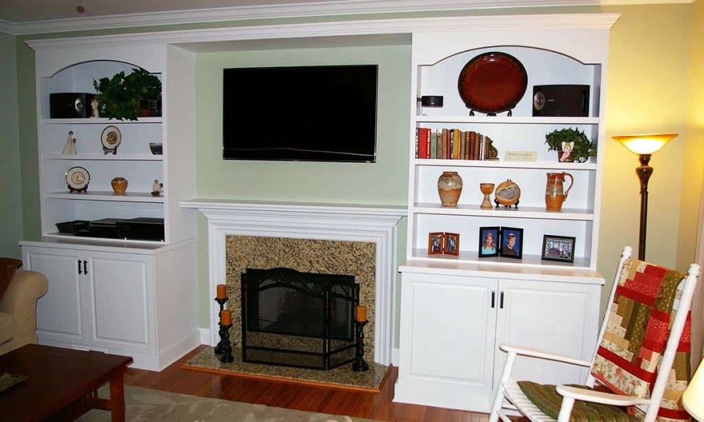 Custom fireplace and framing bookshelves