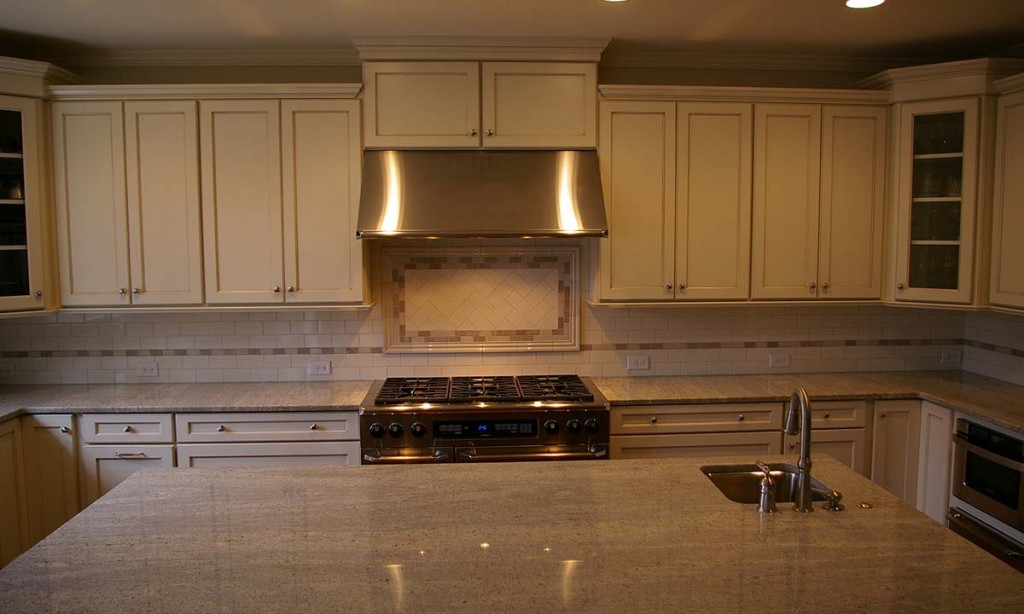 Photo shows massive new island and second sink made possible by kitchen remodel
