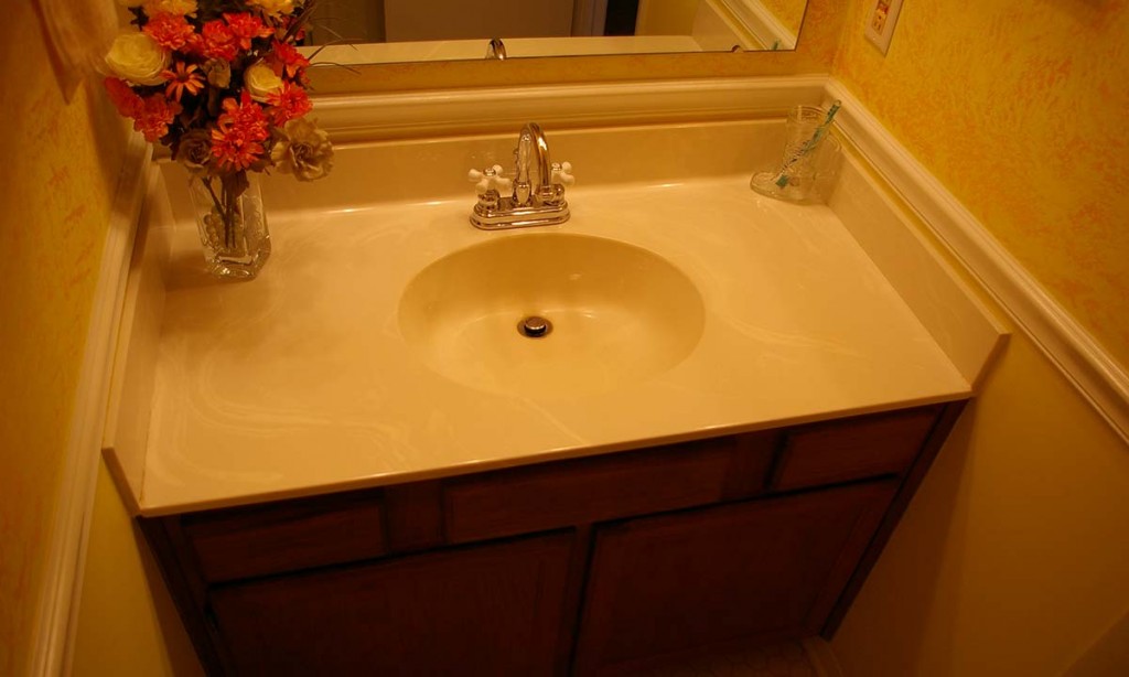 Dated powder room sink and countertop made space look smaller