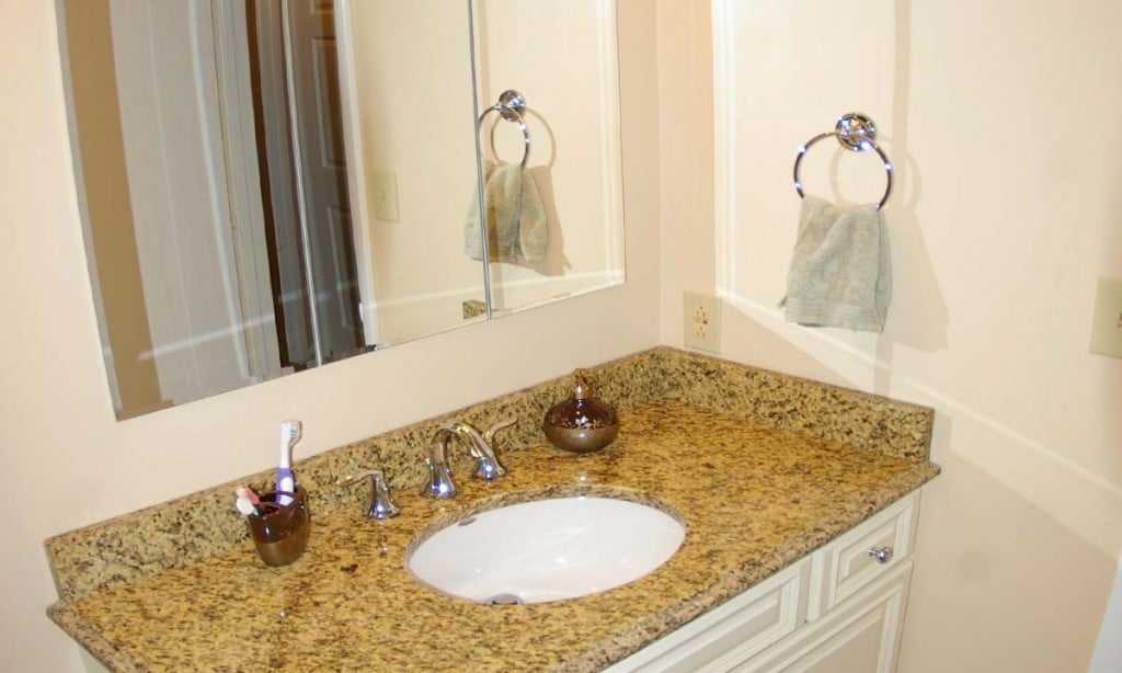 Granite countertop in powder room increased usability and beauty