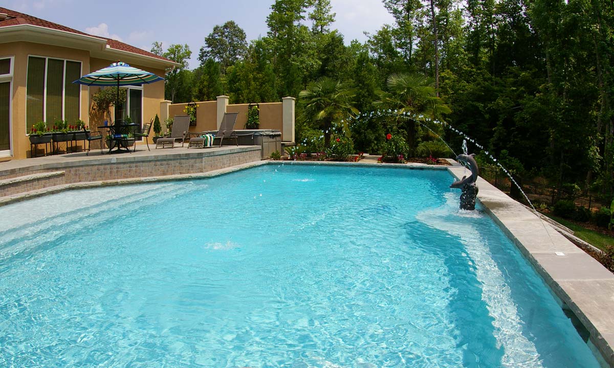 View of the Mediterranean styled pool in the back of the custom home