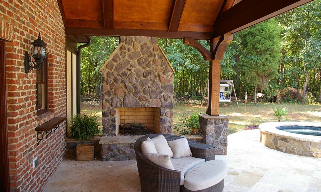 Pool house with custom outdoor fireplace