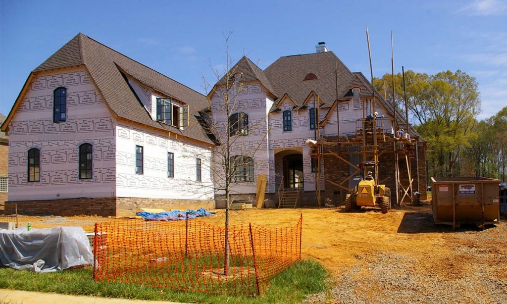 Tuscan country manor, a custom home built near Charlotte, NC, is under construction in this photo