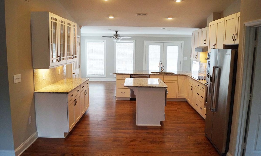 Picture of whole kitchen and new floor plan of this remodeled home