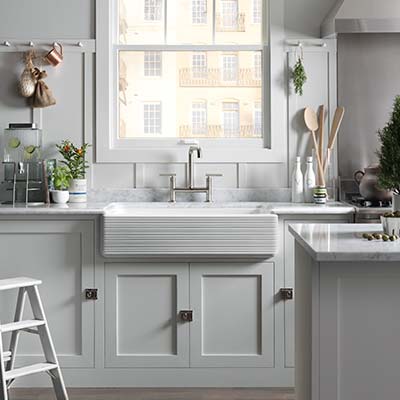 Front facing view of a Hayridge design on Whitehaven kitchen sink with a Purist kitchen faucet