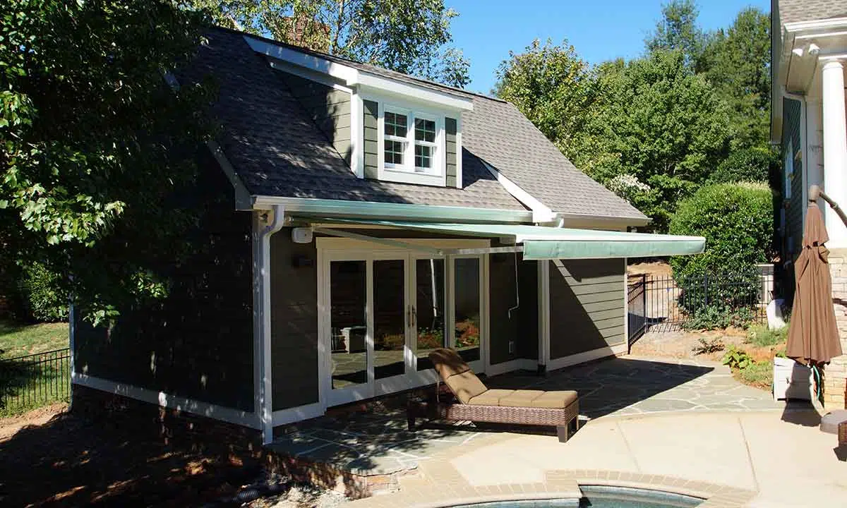 Completed Pool House Sunroom and New Retractable Awning Exterior