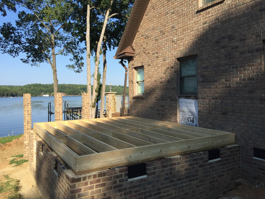 lakefront home beginning stages of addition