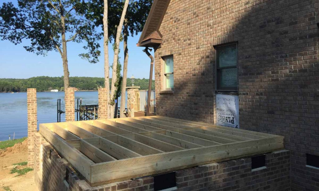lakefront home beginning stages of addition