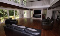 living room remodel with TV above fireplace