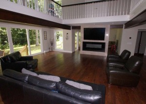 living room remodel with TV above fireplace