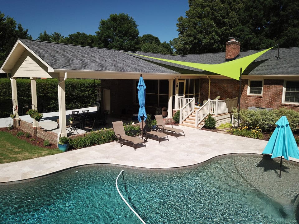 outdoor pool and renovated outdoor living space with covered patio