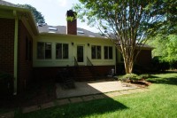 after exterior photo of sunroom and bonus room addition