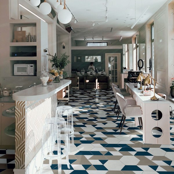 beauty salon with statement geometric tile floor