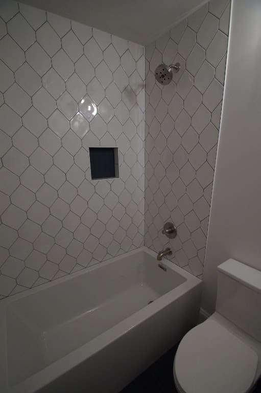 image of bathroom after renovation with white tile