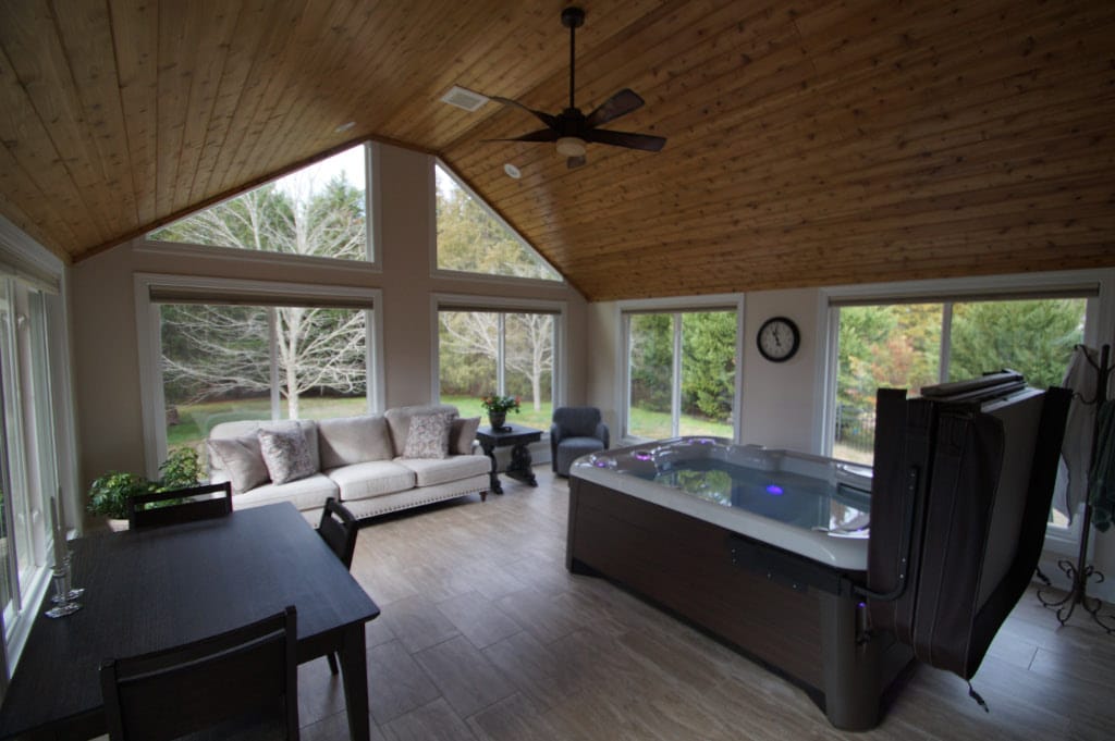 sunroom with hot tub