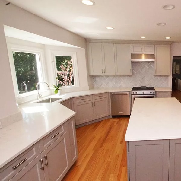 kitchen remodel with gray cabinets and white countertops