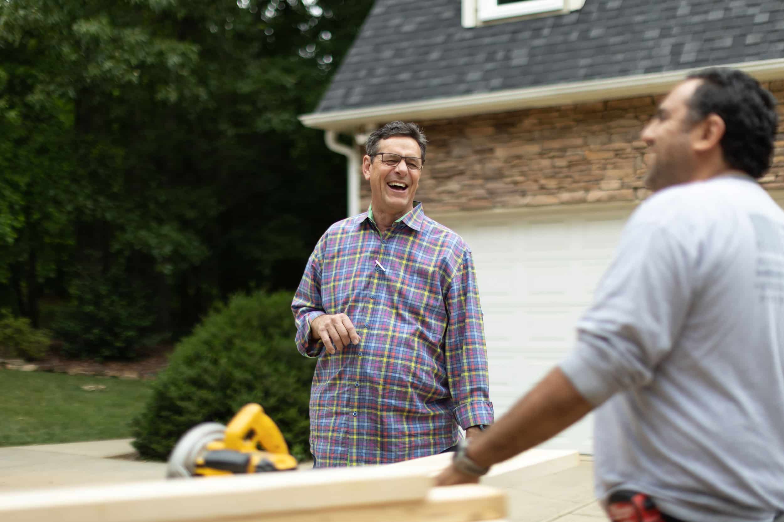 Gary Palmer laughing with contractor