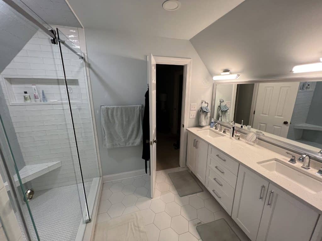 updated stand up shower and dual sinks
