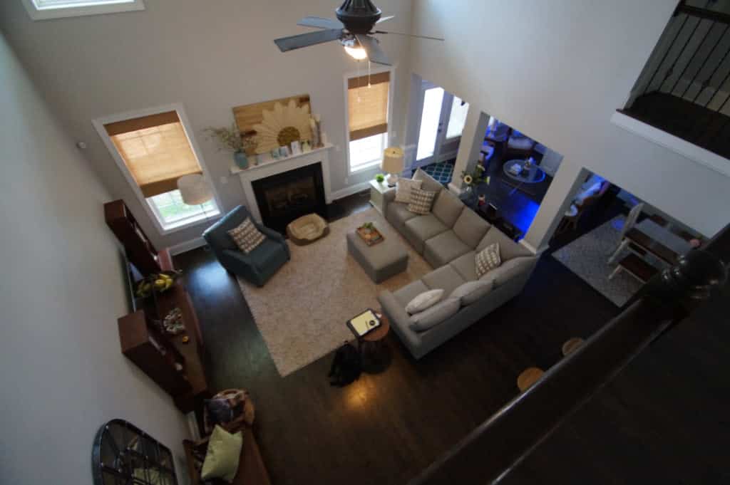 image of living room with high ceiling before the floor over