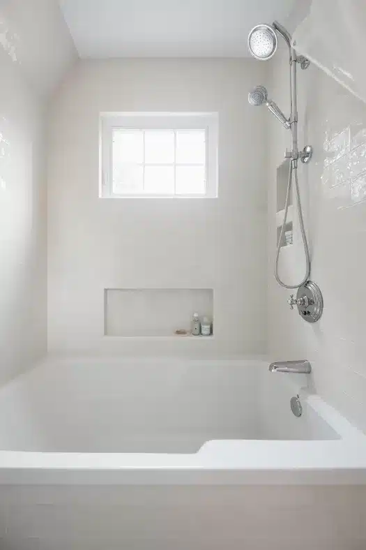 white bathtub and tile