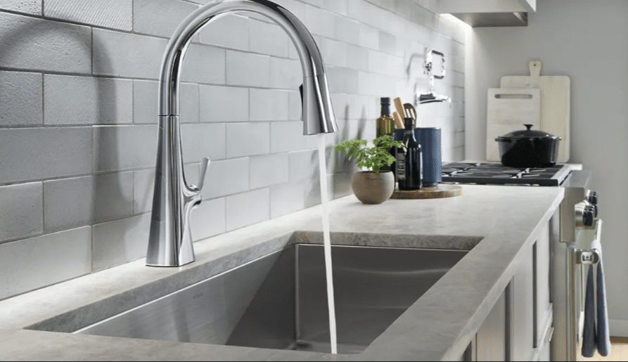 modern silver faucet from Kohler in gray and white kitchen
