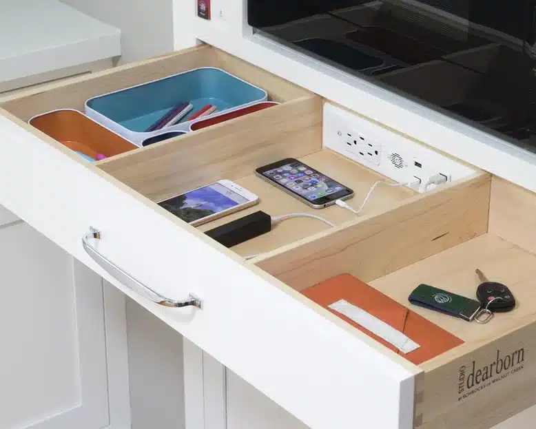 organized pull out drawer with charging station for electronics