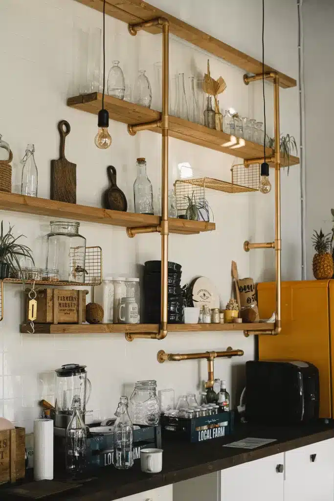 bronze and wood open shelving about kitchen countertop