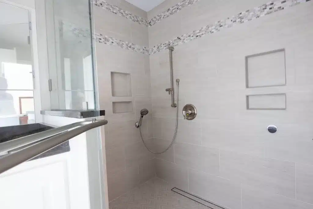 large walk in shower with white tile