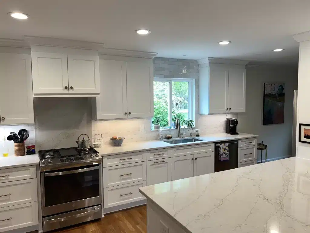 white kitchen with white quartz countertops with kitchen island