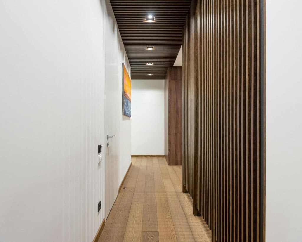 hallway with wooden ridged walls for texture