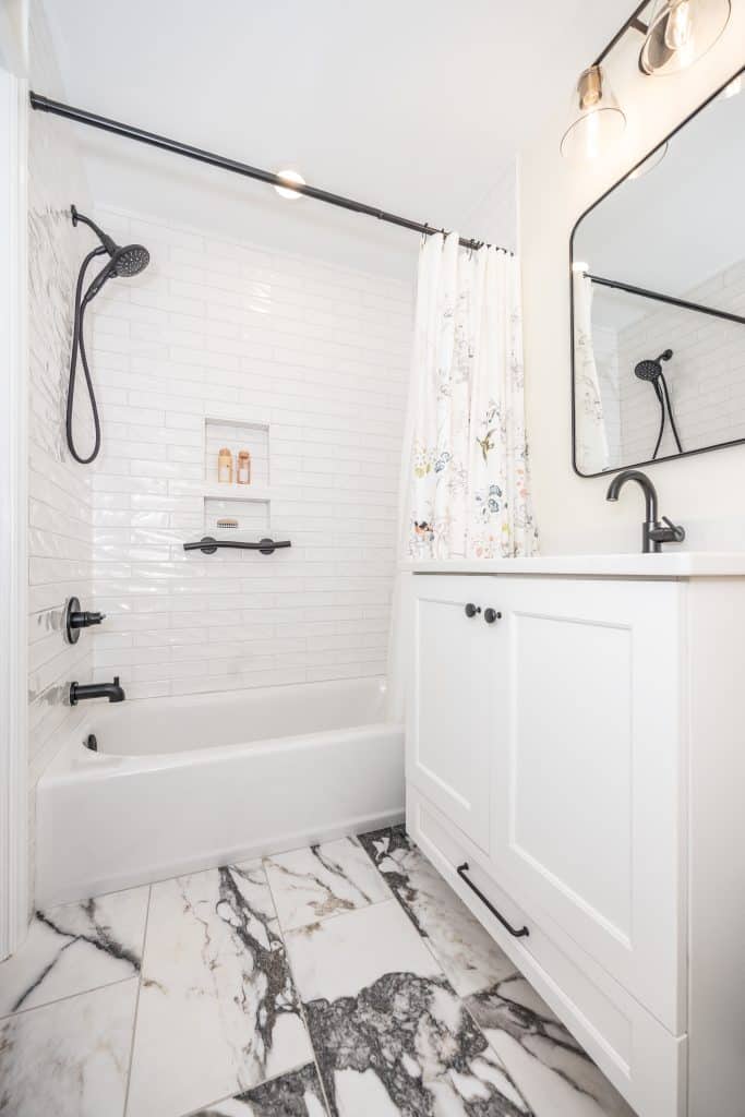 white subway tile bathroom with overhead shower