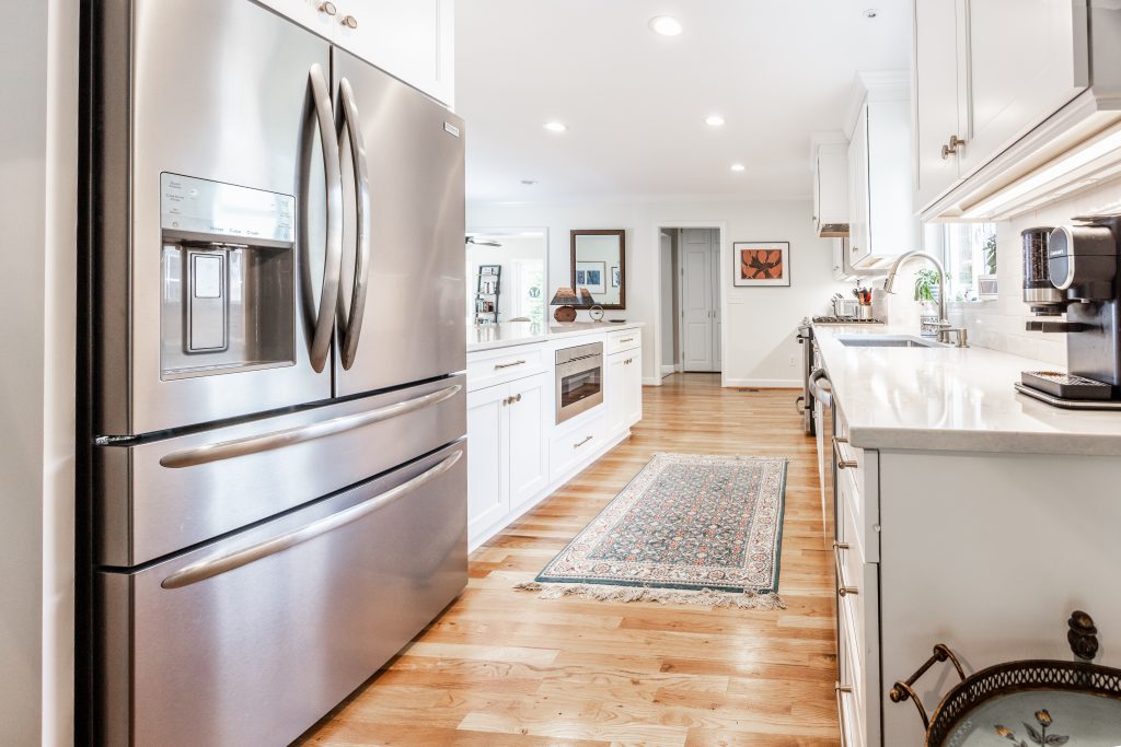 kitchen with stainless steel appliances wood floors and kitchen island