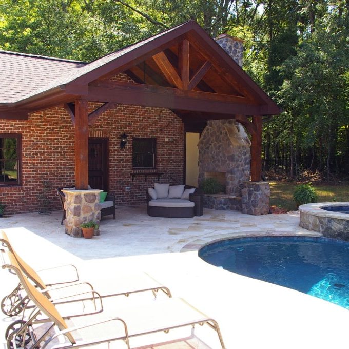accessory-dwelling-unit-contractor The courtyard of the pool house is centered around a fireplace and a sitting area where family and friends can relax and enjoy each other's company.
