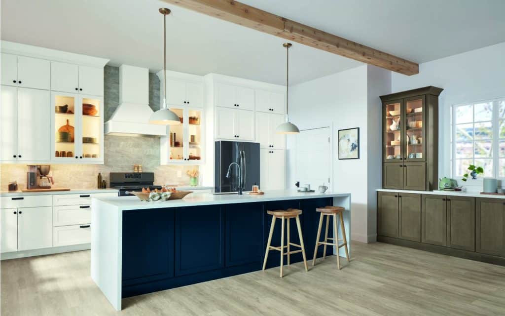 white and navy blue modern kitchen remodel with short barstools at long kitchen island