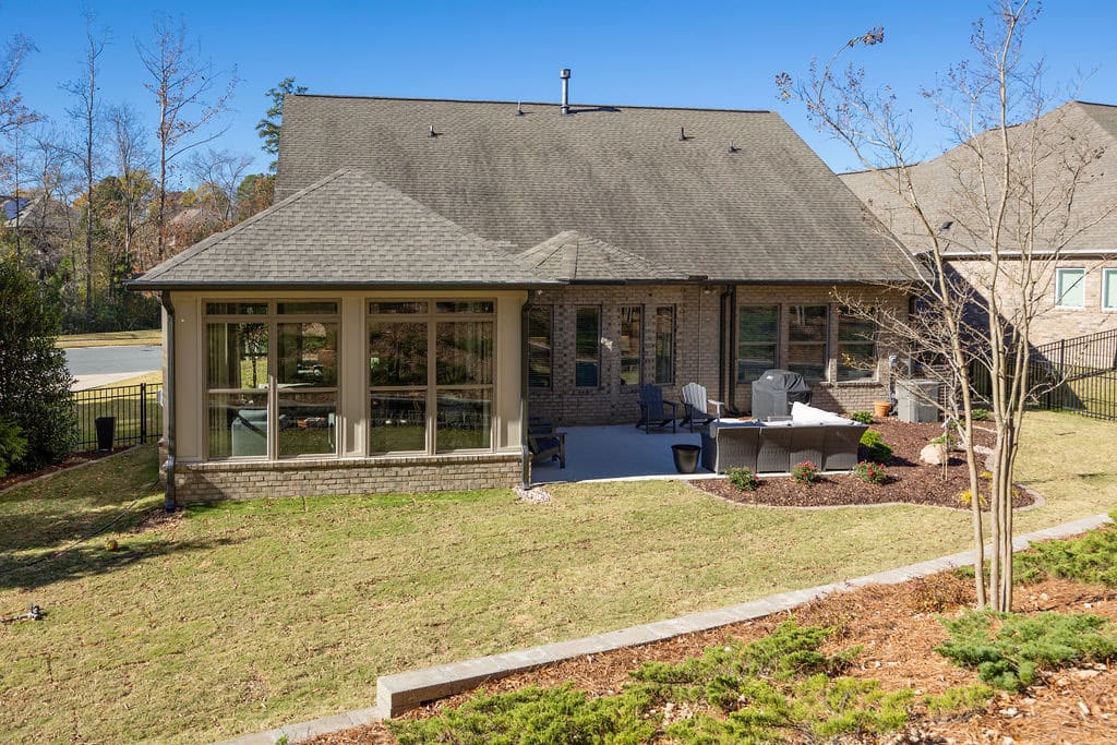 exterior of sunroom remodel with floor to ceiling windows