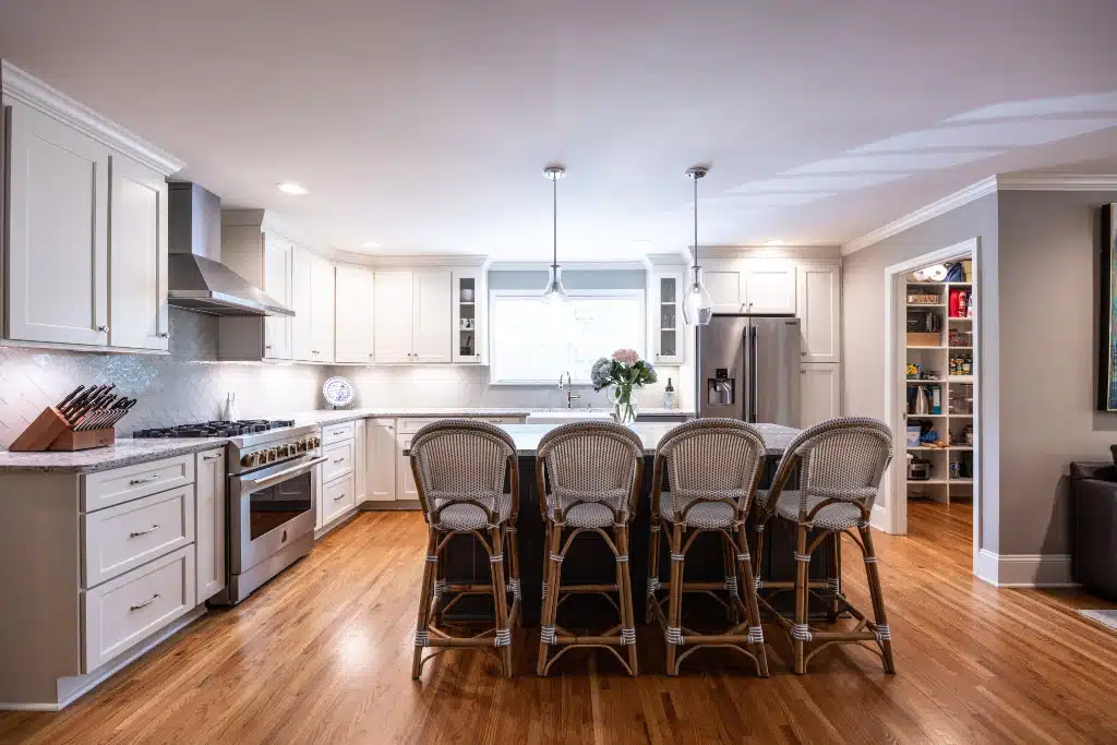 kitchen remodel with a center kitchen island and 4 bar stools