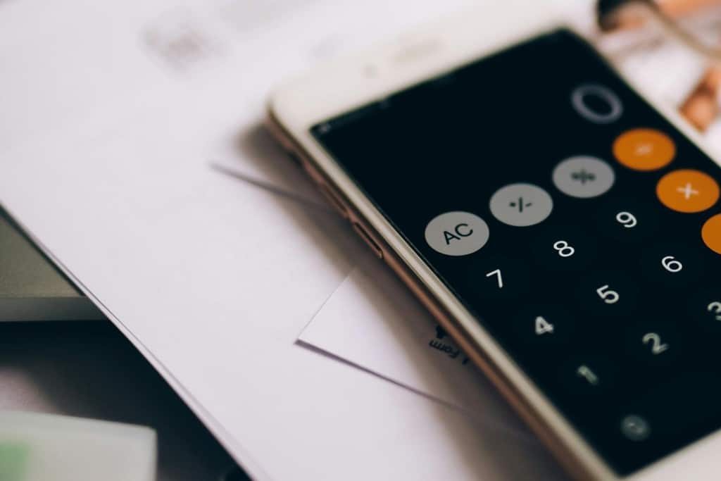 calculator sitting on top of remodel plans