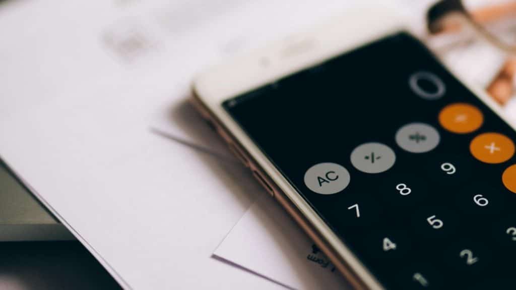 calculator sitting on top of remodel plans