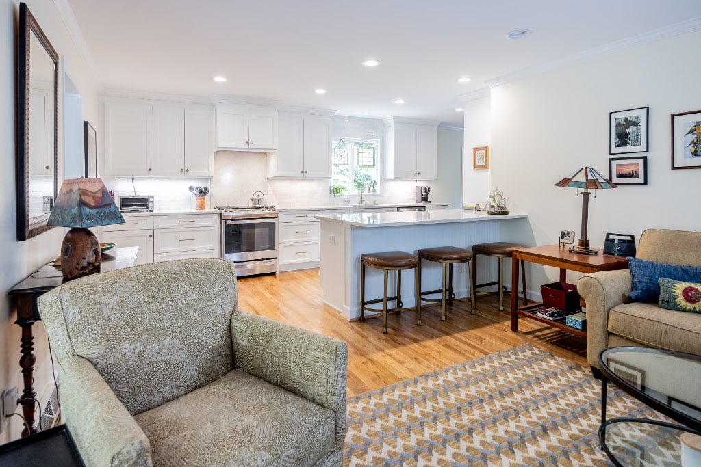 open floor plan kitchen with peninsula island opening to living room
